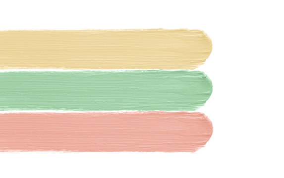 Color Corrector Strokes Isolated On White Background. Green Peach Yellow Color Correcting Concealer Cream Smudge Smear Swatch Sample. Makeup Base Creamy Texture