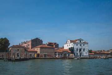Fototapeta na wymiar Buildings and architecture by water, in Cannaregio, Venice, Italy