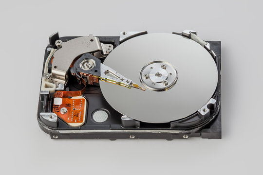 hard drive disassembled on a gray background top view