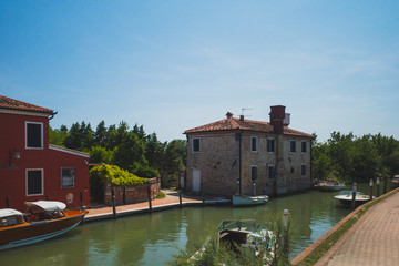 Houses by canal on island of Torcello, Venice, Italy