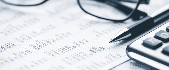  Close-up Pen Calculator And Reading Glasses On Financial Report - Business Accounting Concept