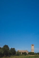 Fototapeta na wymiar Cathedral of Santa Maria Assunta and bell tower under blue sky on island of Torcello, Venice, Italy