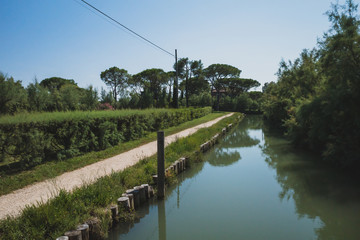 Path by river on island of Torcello, Venice, Italy