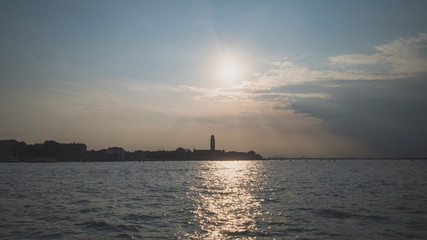 Island of Venice over water at sunset, Venice, Italy