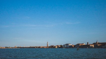 Island of Venice over water at sunset, Venice, Italy