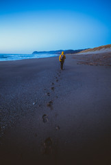 The man hiking on the beach