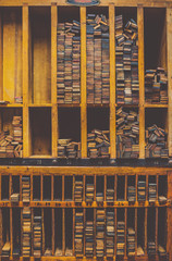 Wooden printmaking blocks rest on shelves it a university classroom