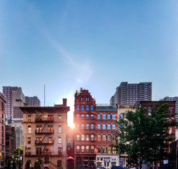 Historic block of buildings with sunlight background in the Tribeca neighborhood of Manhattan in...