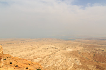 Fototapeta na wymiar Judaean Desert panorama with wadis and salt lake dead sea seen from Masada fortress, Israel