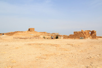 Panorama with ruins of palace and fortress Masada on Judaean Desert rock plateau, Israel
