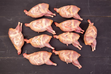 Raw quail meat on a wooden background - 307550705