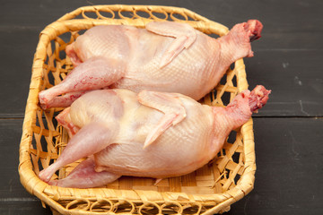 Raw quail meat on a wooden background - 307550763