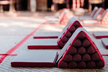 Lanna style backrest pillows lined up