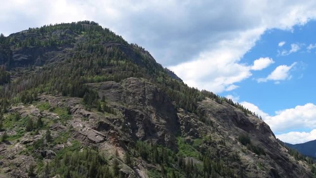 Ouray scenic Million Dollar Highway 550 road in Colorado summer with mountain peak in slow motion driving pov panning