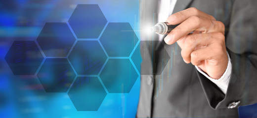 Businessman use the pen to point to digital virtual screen technology with icon holder In hexagonal...