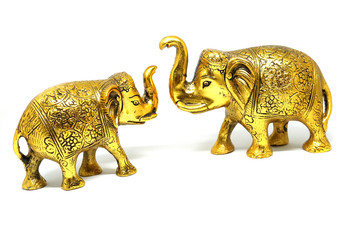 Golden Colored  Elephant Toy Art, Elephant couple on isolated white background.
