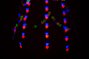Colorful abstract heart shape blured bokeh at night
