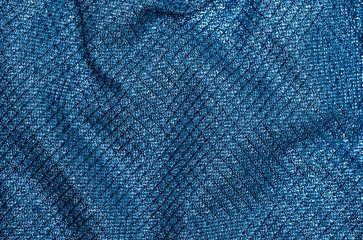 Texture of sparkling fabric in trendy blue color. Main color of the year 2020.