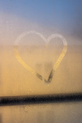 Heart on the fogged glass. Morning outside the window. Love. declaration of love. Background.