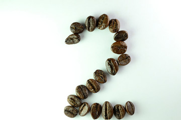 Coffee Been, the number two is formed with coffee beans in white background