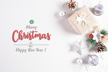 Fototapeta na wymiar Christmas holidays composition Top view of gift box with Christmas tree decoration and red berries on white background with copy space for text.