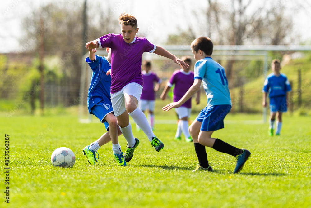 Wall mural kids soccer football - children players match on soccer field