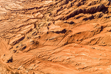 The Flaming Mountains are barren eroded red sandstone hills in Tian Shan Mountain range Xinjiang China.