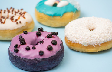 Flat lay of donut on blue background