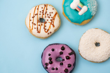 Flat lay of donut on blue background