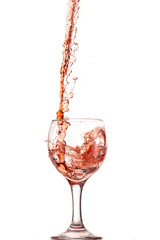 pouring red wine into a glass, strong flow and splash