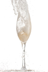 pouring white wine, champagne into a tall glass, strong flow and splash