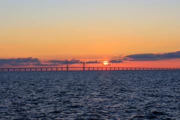 Fototapeta na wymiar Oresunds bridge at sunset from the swedish side over to Denmark