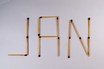 letter jan for January with matches in white background