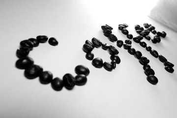 Coffee Coffee, the letter of bean is formed with coffee beans in white background