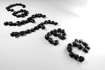 Coffee Coffee, the letter of bean is formed with coffee beans in white background