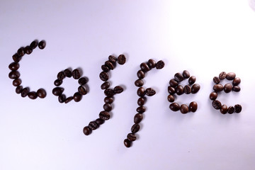 Coffee Coffee, the letter of bean is formed with coffee beans in white background