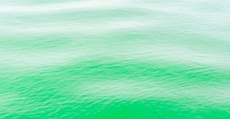 Bright green Tones Water Waves Surface as Background