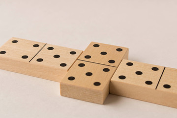 Playing dominoes on a white background. Leisure games concept. Domino effect.