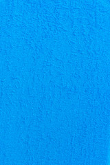 Vertical image of blue towel, cloth, fabric surface backgrounds/Textures. 