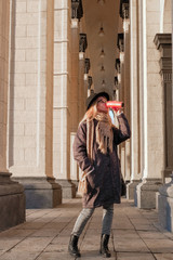 Portrait of a woman in autumn clothes. Winter and autumn trend.