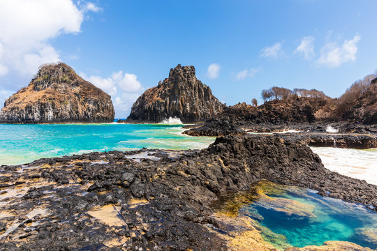 View of one of the stunning natural pools in Baia dos Porcos in Fernando de Noronha, Brazil