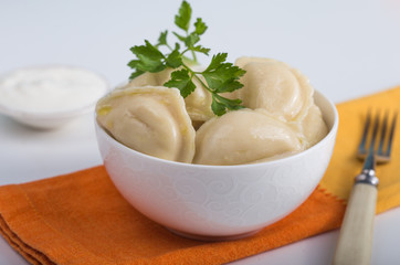 Dumplings with potato filling. Color table. Vareniki. Traditional Ukrainian food. Varenyky with potato
