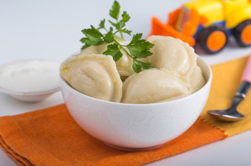 Dumplings with potato filling. Color table. Vareniki. Traditional Ukrainian food. Varenyky with potato