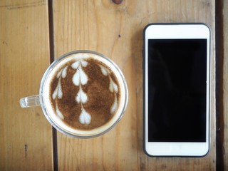 Smart phone and latte art coffee