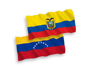 National vector fabric wave flags of Venezuela and Ecuador isolated on white background. 1 to 2 proportion.