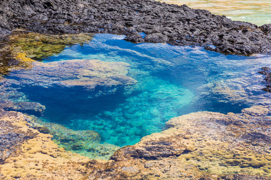 View of one of the stunning natural pools in Baia dos Porcos in Fernando de Noronha, Brazil