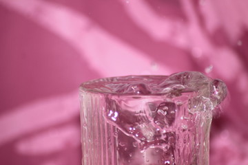water splashes drops pink background