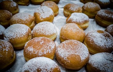 Festive sweet donuts are traditional symbols of Hanukkah Holiday. 