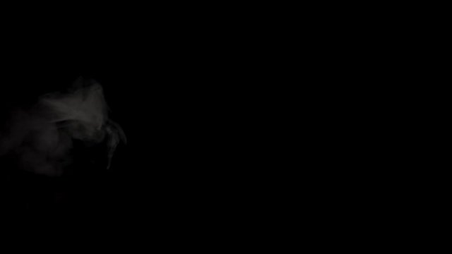 Smoke (steam,vapor,fog), VFX element. Realistic smoke, ice or fire smoke, clouds of steam on a black background (alpha channel) A stream of smoke scatters in the air. Double slowdown. 4K