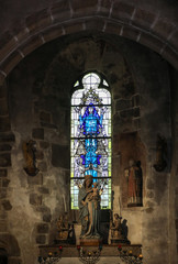 Stained glass in Saint Pierre parish church. Mont Saint Michel, France